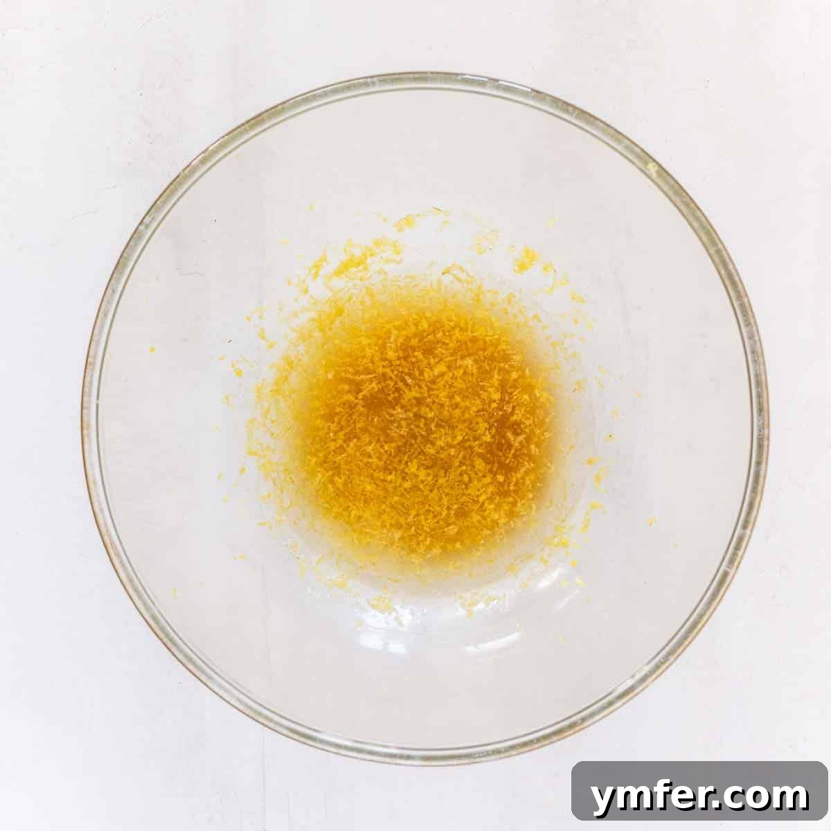 Zesty Plant-Based Lemon Squares 7 Combining wet ingredients for the vegan lemon bar crust in a bowl.