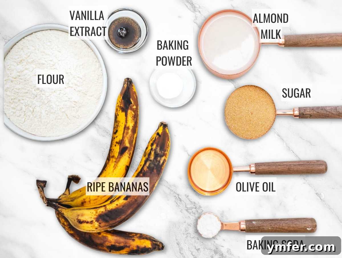 Plant-Powered Banana Bread Perfection 4 A collection of ingredients for making vegan banana bread: ripe bananas, flour, milk, sugar, oil, vanilla, baking powder, baking soda, and salt