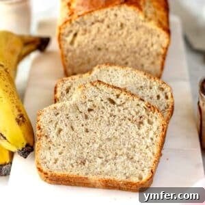 vegan banana bread slices on a white cutting board