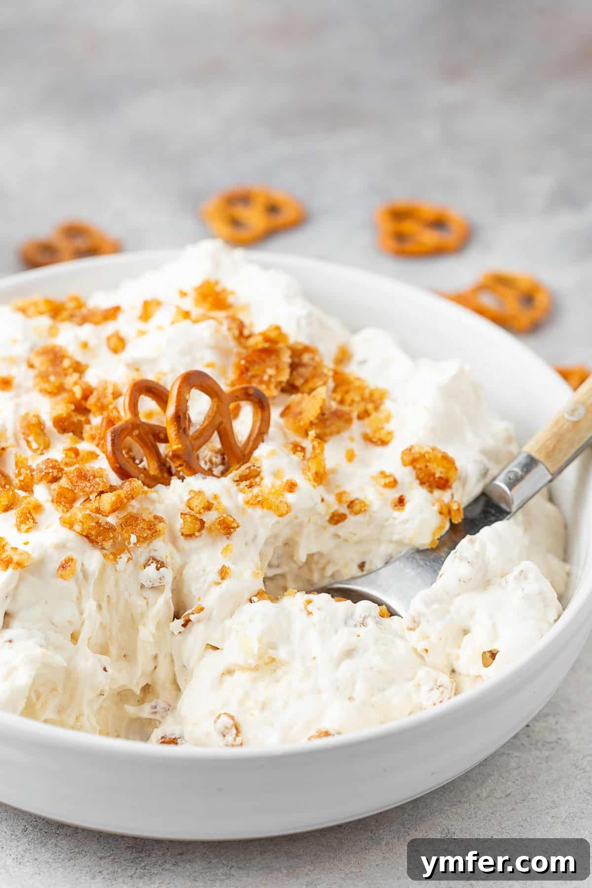 Pineapple Pretzel Dream 4 A bowl of Pineapple Pretzel Fluff ready to be served, topped with pretzel brittle.