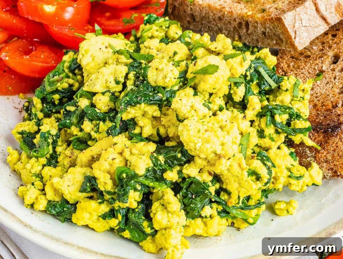 Plant-Powered Scramble 14 A plate of spinach tofu scramble, a wholesome and nutritious vegan meal.