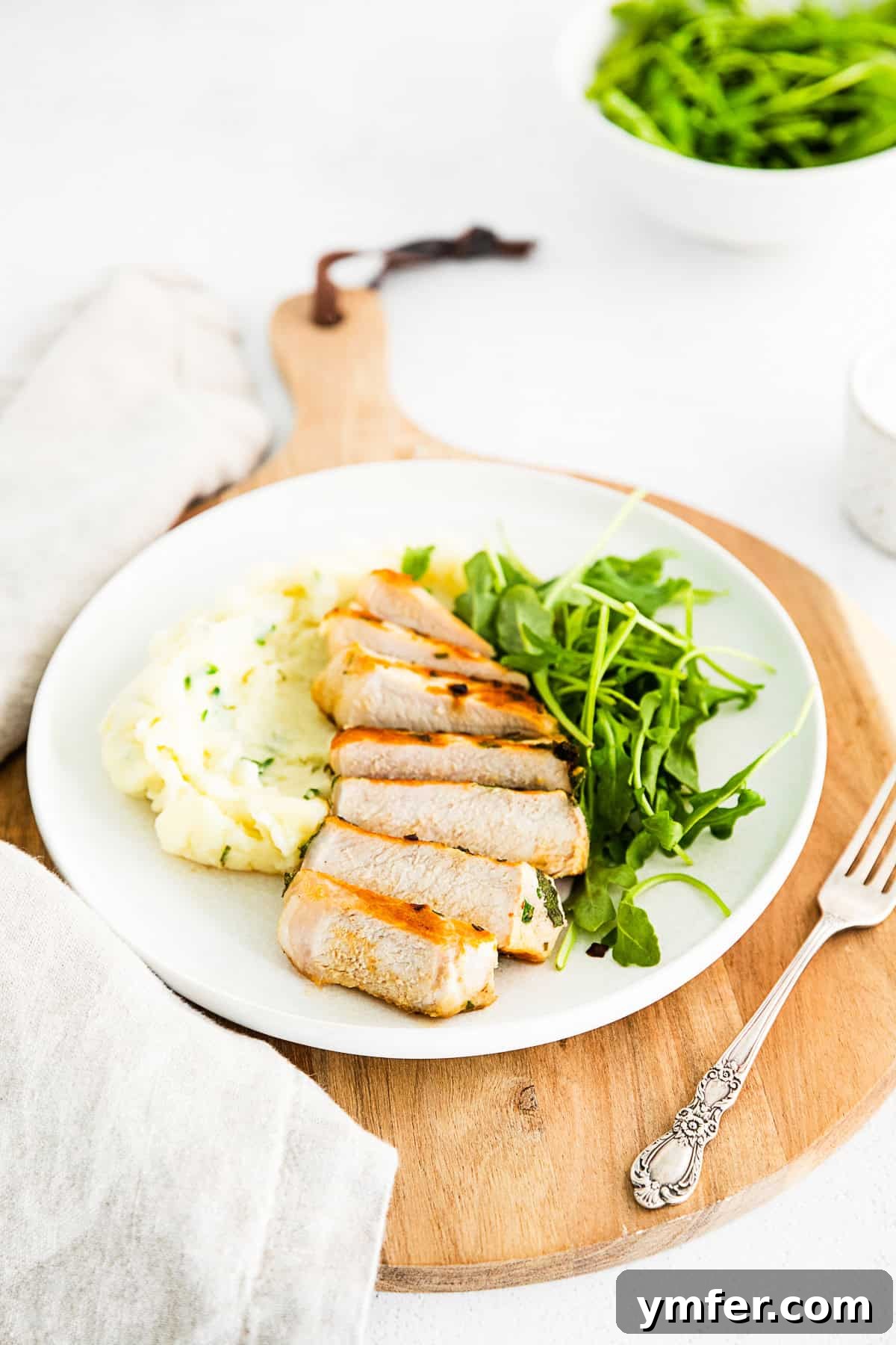 Sliced grilled pork chops on a plate. 