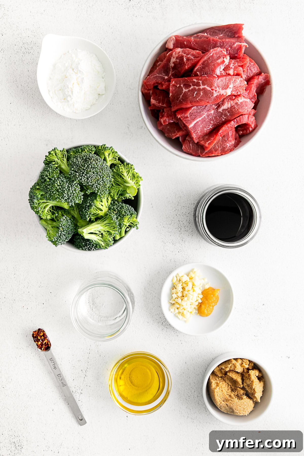 Speedy Instant Pot Mongolian Beef 3 A vibrant bowl featuring Instant Pot Mongolian beef with fresh broccoli, green onions, and sesame seeds, ready to be served.
