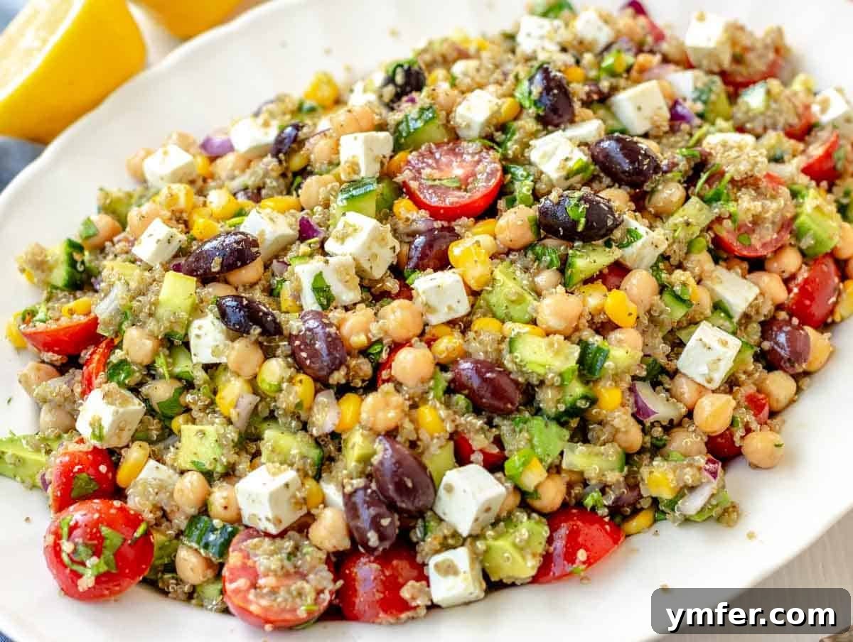 35 Stress-Free Dinner Recipes 14 Chickpea quinoa salad with feta on a white platter, colorful and nutritious