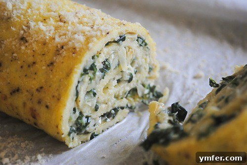 Swirled Spinach Artichoke Egg Roll 4 Spinach Artichoke Egg Roulade served on a pristine white serving tray, garnished with fresh herbs.