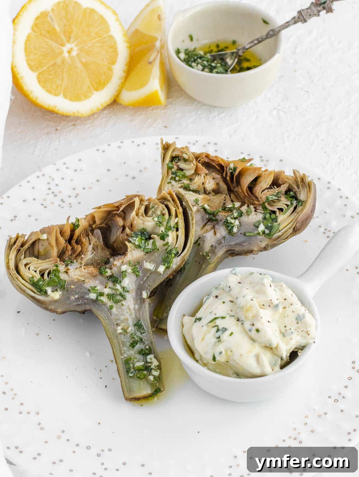 Steamed artichokes ready to be enjoyed with a delicious dip.