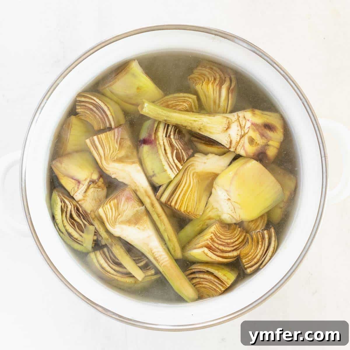 Boiling artichokes and potatoes in water