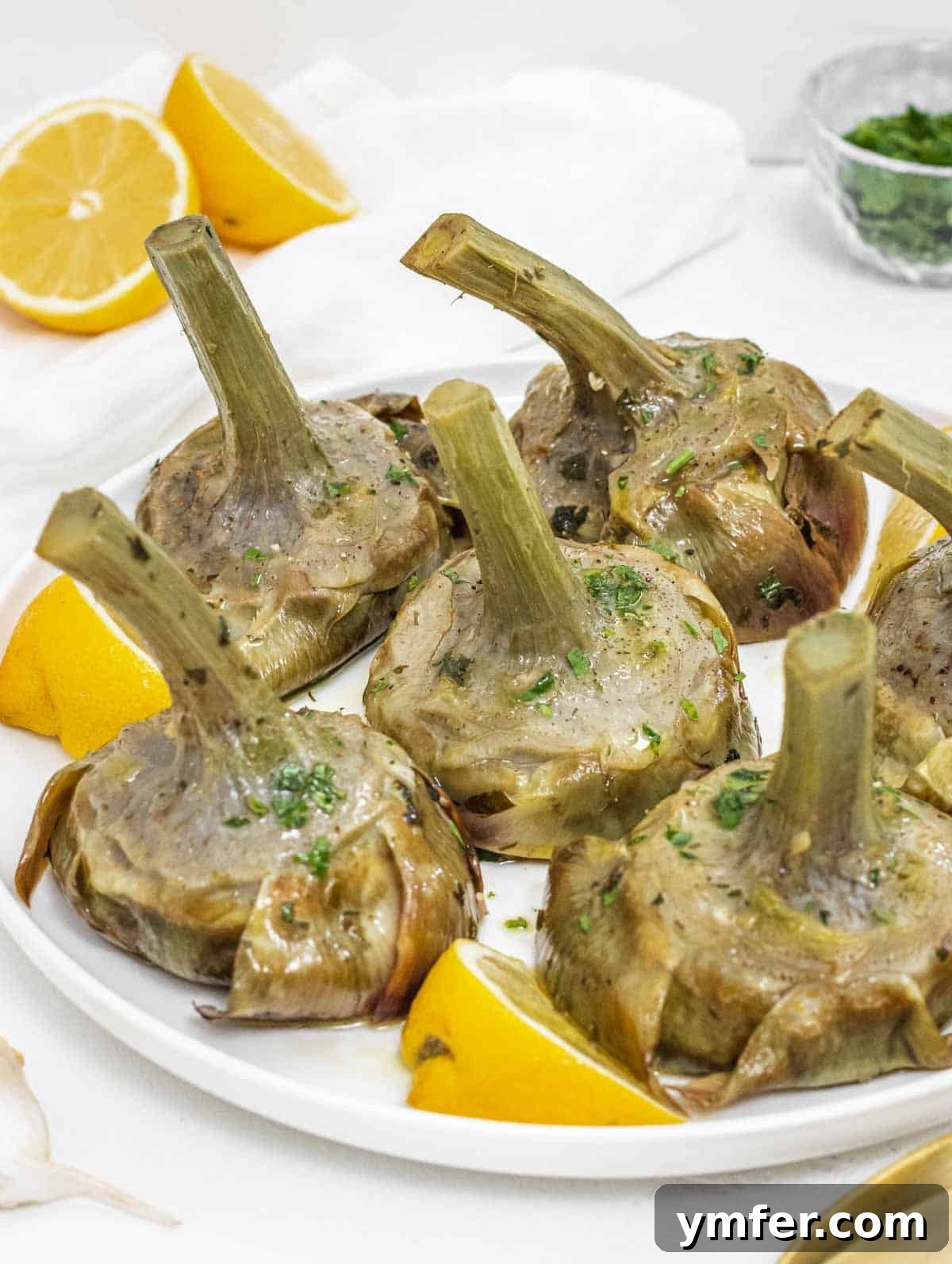 Rome's Signature Artichokes 2 Braised artichokes with lemon and parsley, ready to be served