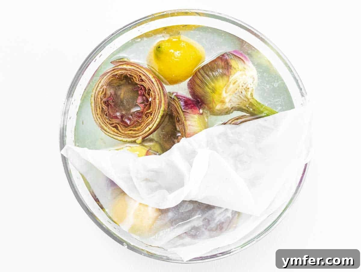 Rome's Signature Artichokes 11 Cleaned artichokes soaking in cold lemon water