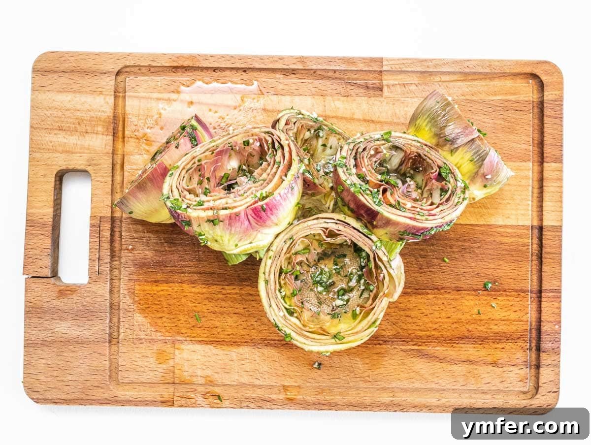 Rome's Signature Artichokes 13 Artichokes being stuffed with olive oil and parsley marinade