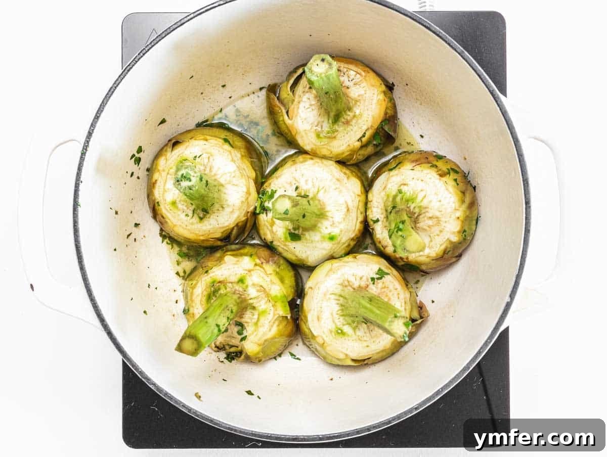 Rome's Signature Artichokes 15 Artichokes simmering in a pot with wine and water