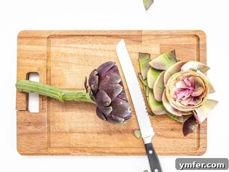 Rome's Signature Artichokes 19 Cutting off the thorns of the artichokes with a serrated knife