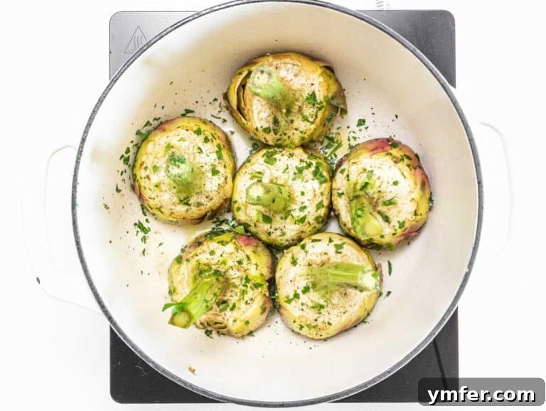 Rome's Signature Artichokes 27 Artichokes arranged tightly in a Dutch oven for braising
