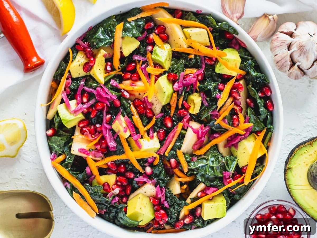 30 Crowd-Pleasing Vegan Starters 13 A vibrant kale salad recipe featuring grated carrots and fresh avocado slices.