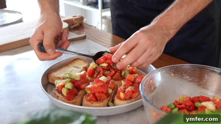 30 Crowd-Pleasing Vegan Starters 29 adding the tomatoes on to the bread