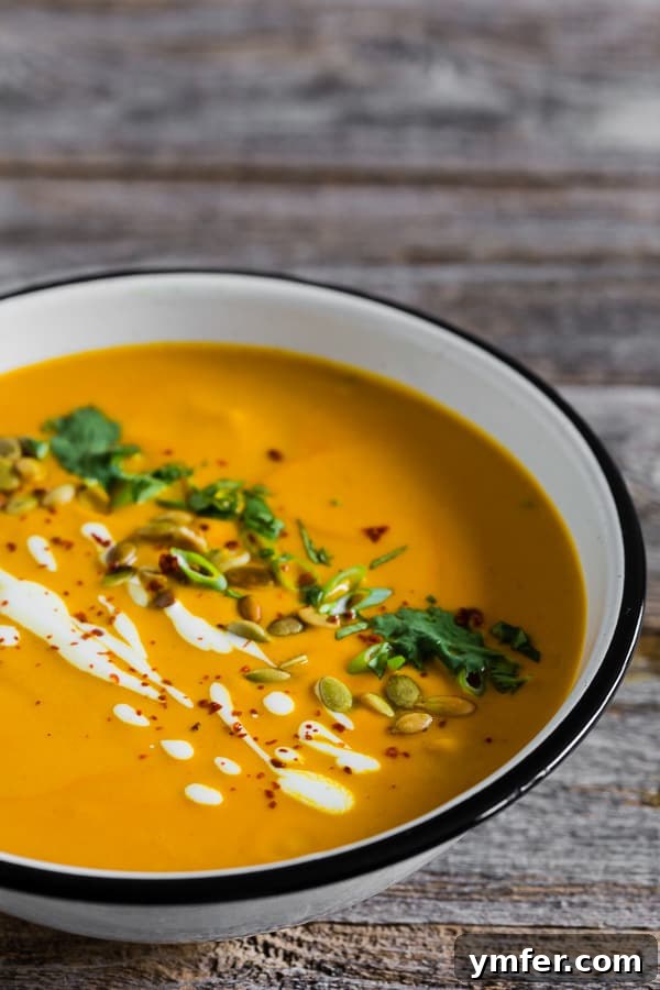 Thai Pumpkin Spice Soup 3 Spicy Thai Pumpkin Soup topped with crunchy pumpkin seeds and fresh cilantro.