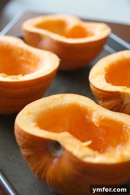 Homemade Pumpkin Puree by Nutmeg Nanny Freshly roasted pumpkin halves ready to be pureed.