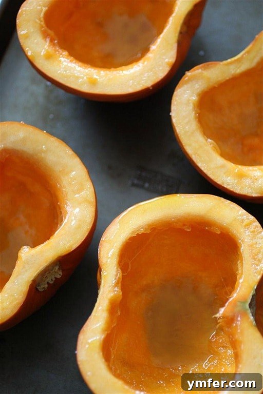 Homemade Pumpkin Puree by Nutmeg Nanny A sliced sugar pumpkin revealing its rich orange flesh.