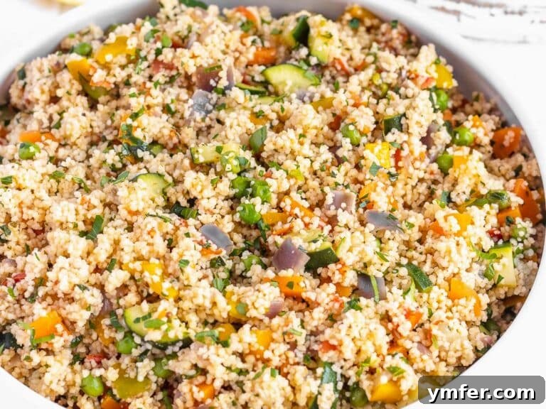 vegetable couscous with peas, zucchini and parsley