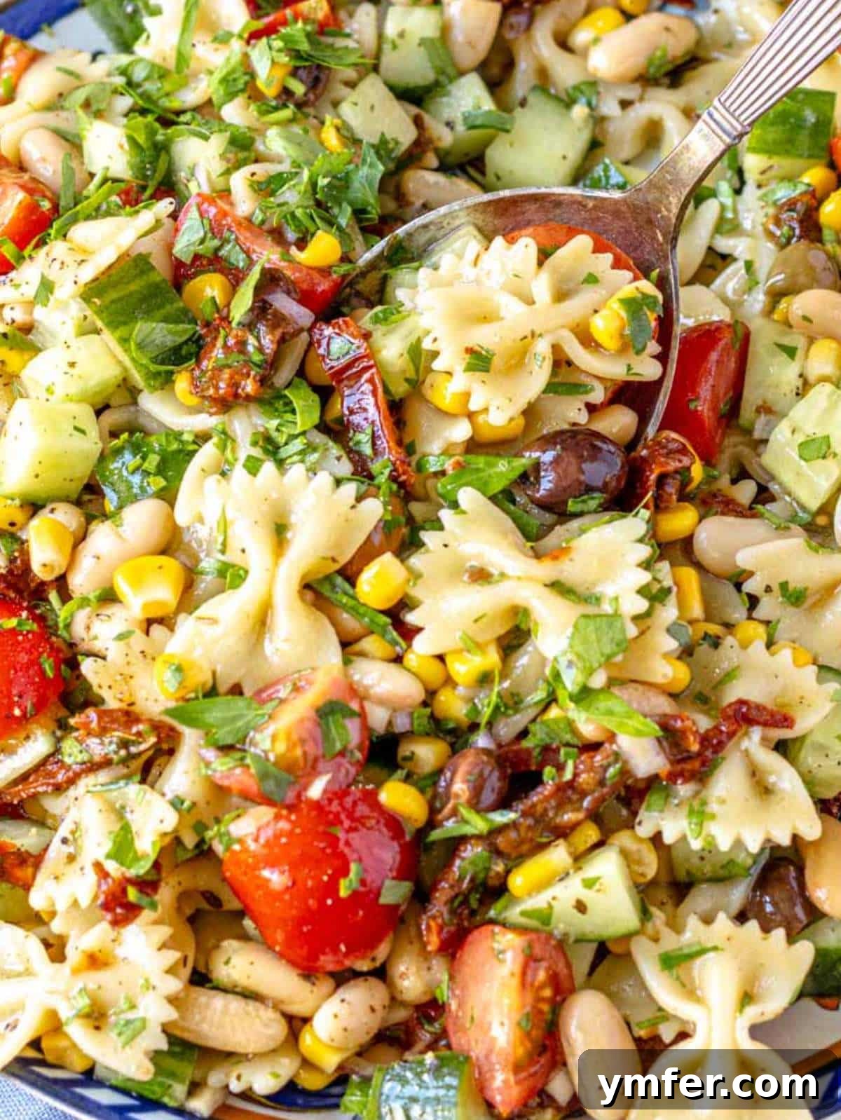 Vibrant Vegan Pasta Salad 2 Easy and colorful vegan pasta salad recipe in a large bowl.