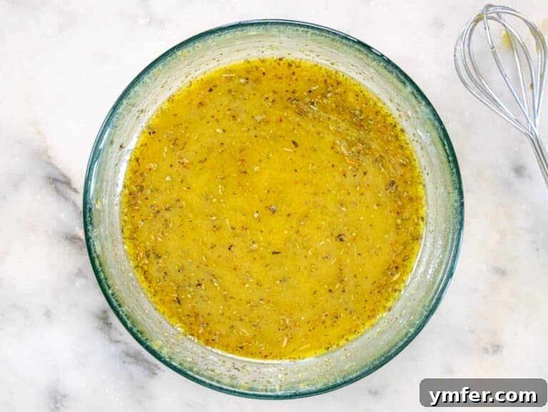 Vibrant Vegan Pasta Salad 12 Italian dressing in a glass bowl.
