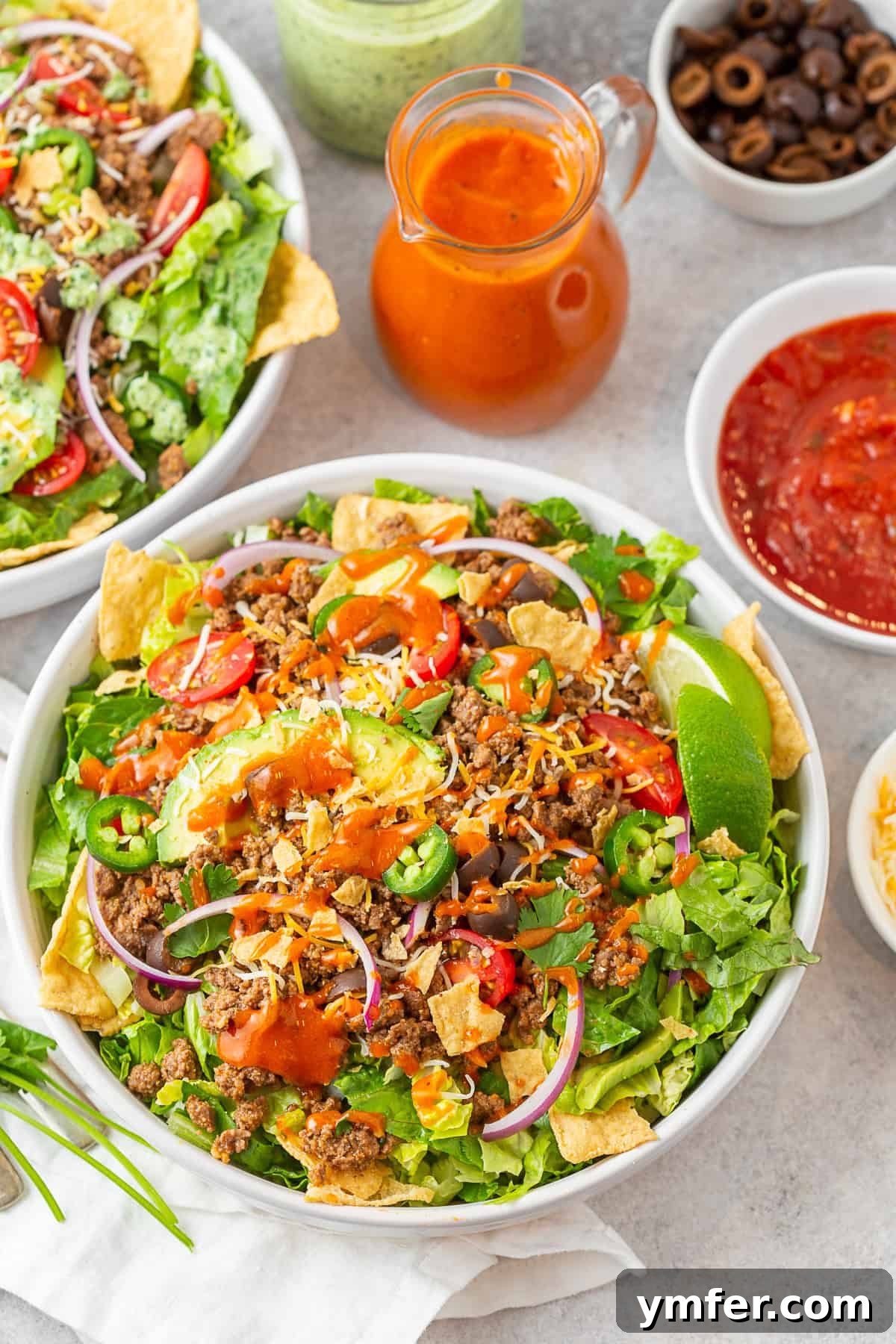 Speedy Taco Salad Delight 2 Easy Taco Salad in a bowl topped with Catalina dressing. Fresh, colorful, and perfect for dinner.