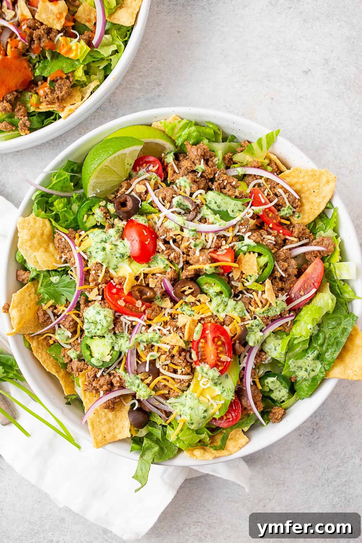 Speedy Taco Salad Delight 4 Easy Taco Salad topped with vibrant cilantro lime dressing, showcasing fresh ingredients.
