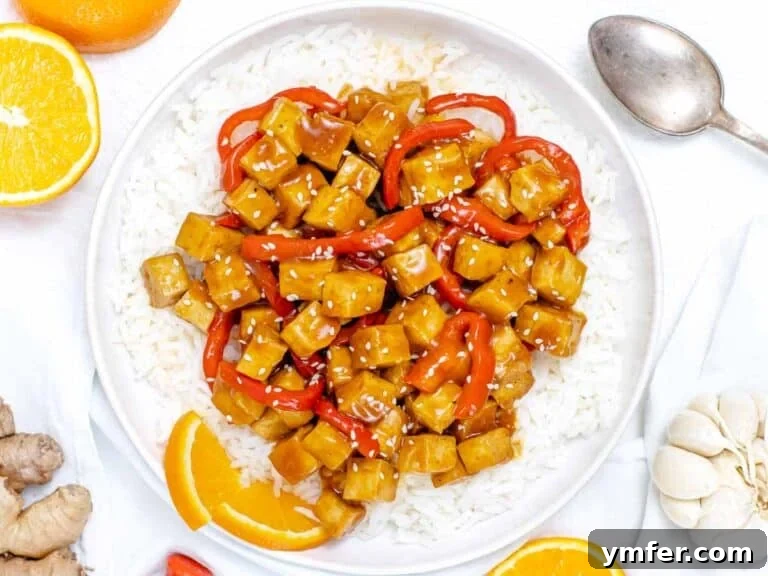 Zesty Orange Tofu 26 orange tofu with bell peppers served on a bowl of rice