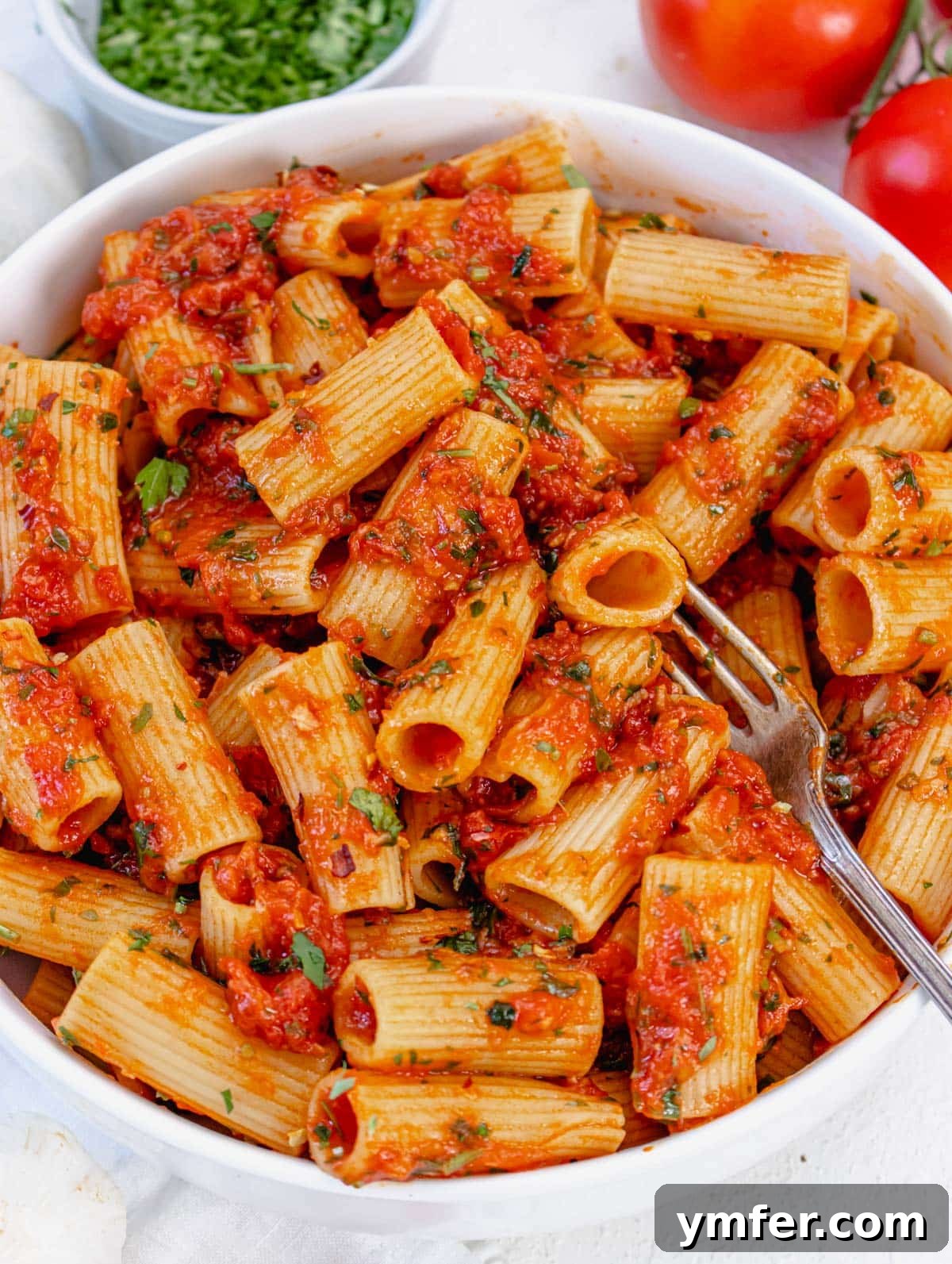 Fiery Rigatoni 2 rigatoni arrabbiata, a spicy Italian pasta dish ready to be served