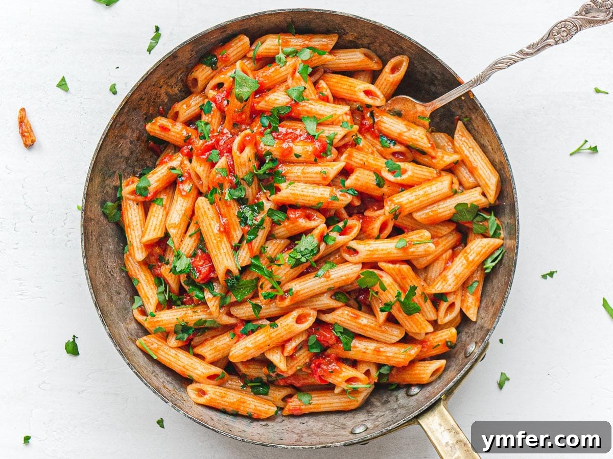 Fiery Rigatoni 13 penne arrabbiata being tossed in a pan