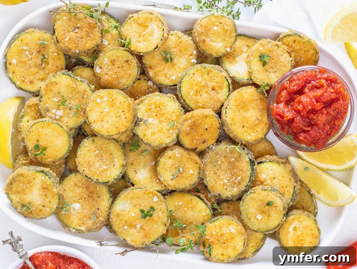 45 Delightful Vegetable Sides 10 Fried zucchini with marinara sauce on a platter