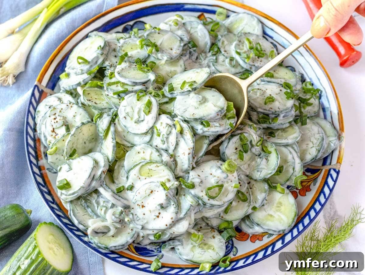45 Delightful Vegetable Sides 34 Creamy cucumber salad served with a golden spoon