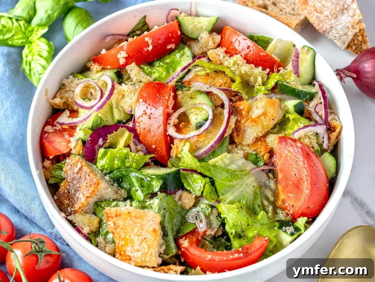 45 Delightful Vegetable Sides 36 panzanella salad in a white bowl.