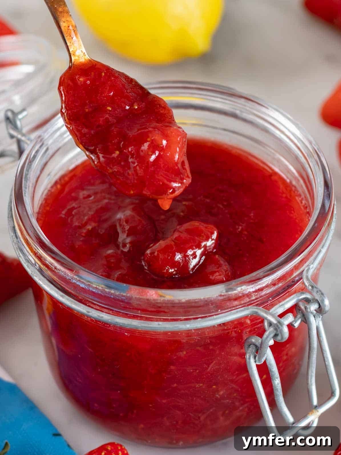 Summer in a Jar 2 Homemade strawberry jam perfectly sealed in a glass jar, ready for storage.