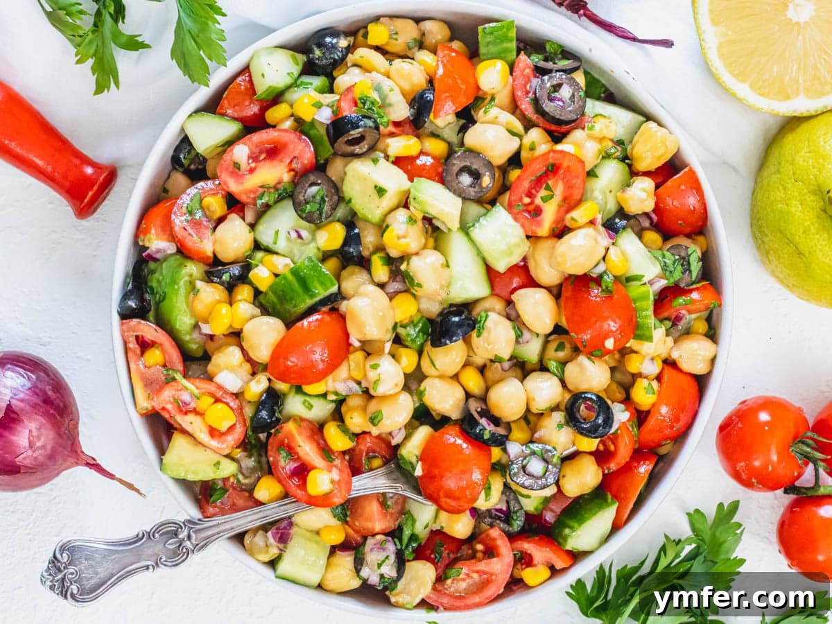 30 Quick & Wholesome Vegan Lunch Recipes 10 Chickpea salad in a bowl with a fork