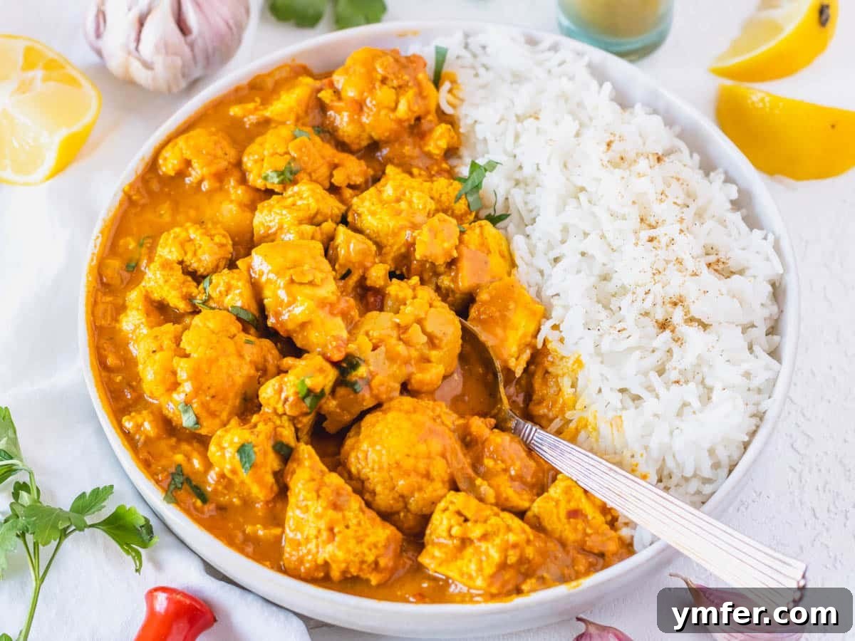 Feast on Plants: 35 Vibrant Recipes 19 Tofu curry served with a side of pristine white rice.