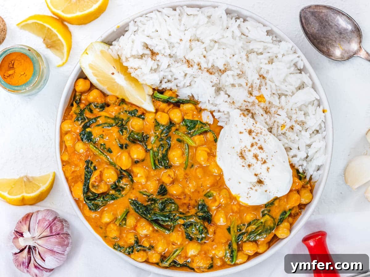 Feast on Plants: 35 Vibrant Recipes 30 Creamy bowl of chickpea curry with spinach and basmati rice.