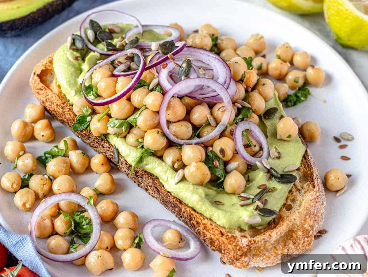 Feast on Plants: 35 Vibrant Recipes 4 Avocado toast topped with marinated chickpeas and finely diced red onion.