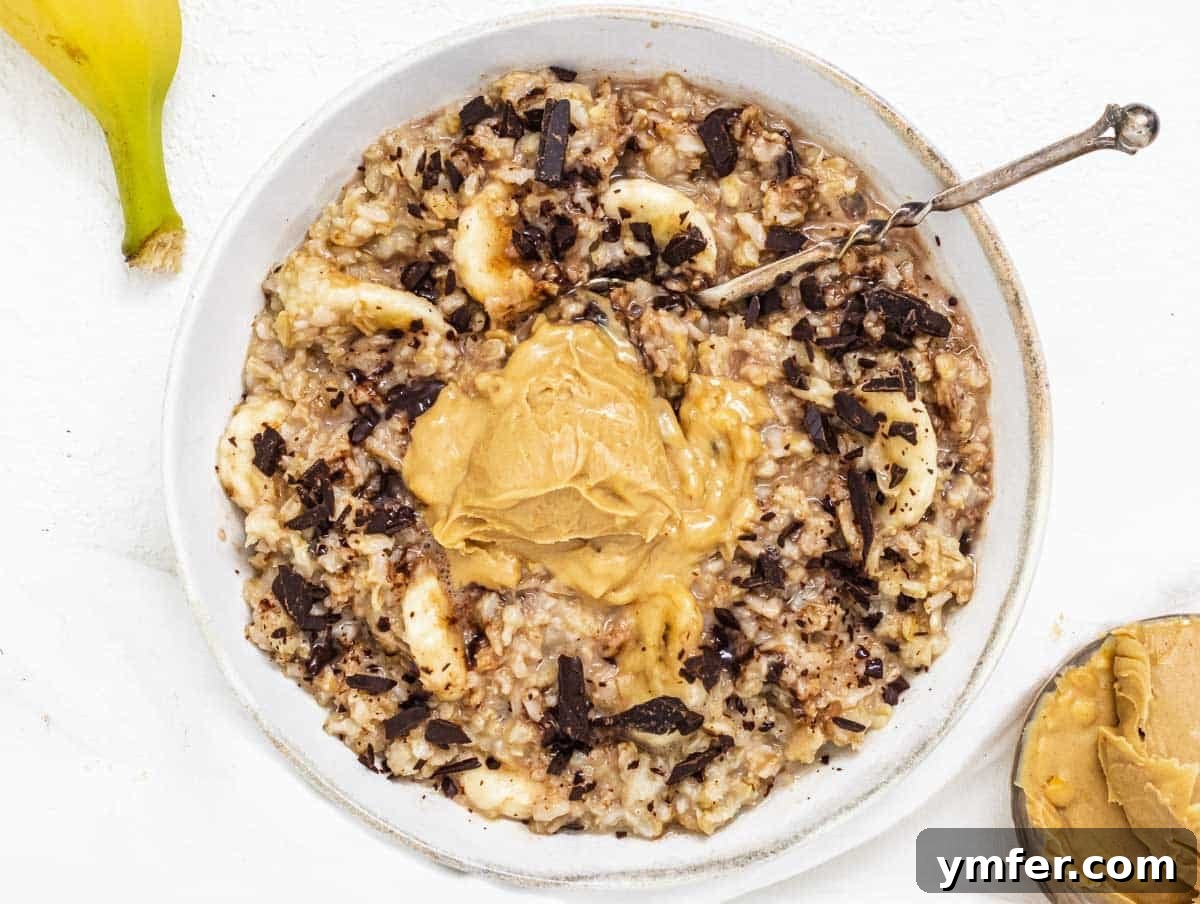 Feast on Plants: 35 Vibrant Recipes 7 A bowl of creamy oatmeal topped with sliced banana and a drizzle of peanut butter.