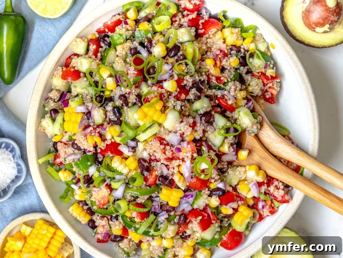 Feast on Plants: 35 Vibrant Recipes 8 Quinoa salad in a white bowl, freshly mixed with colorful vegetables.