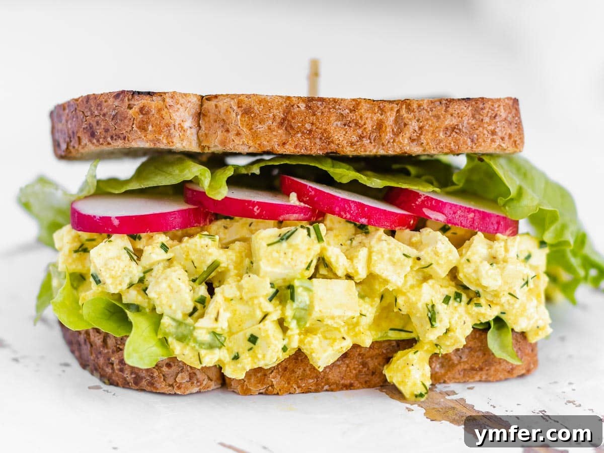 Feast on Plants: 35 Vibrant Recipes 9 Vegan egg salad sandwich, showing the creamy texture and fresh ingredients.