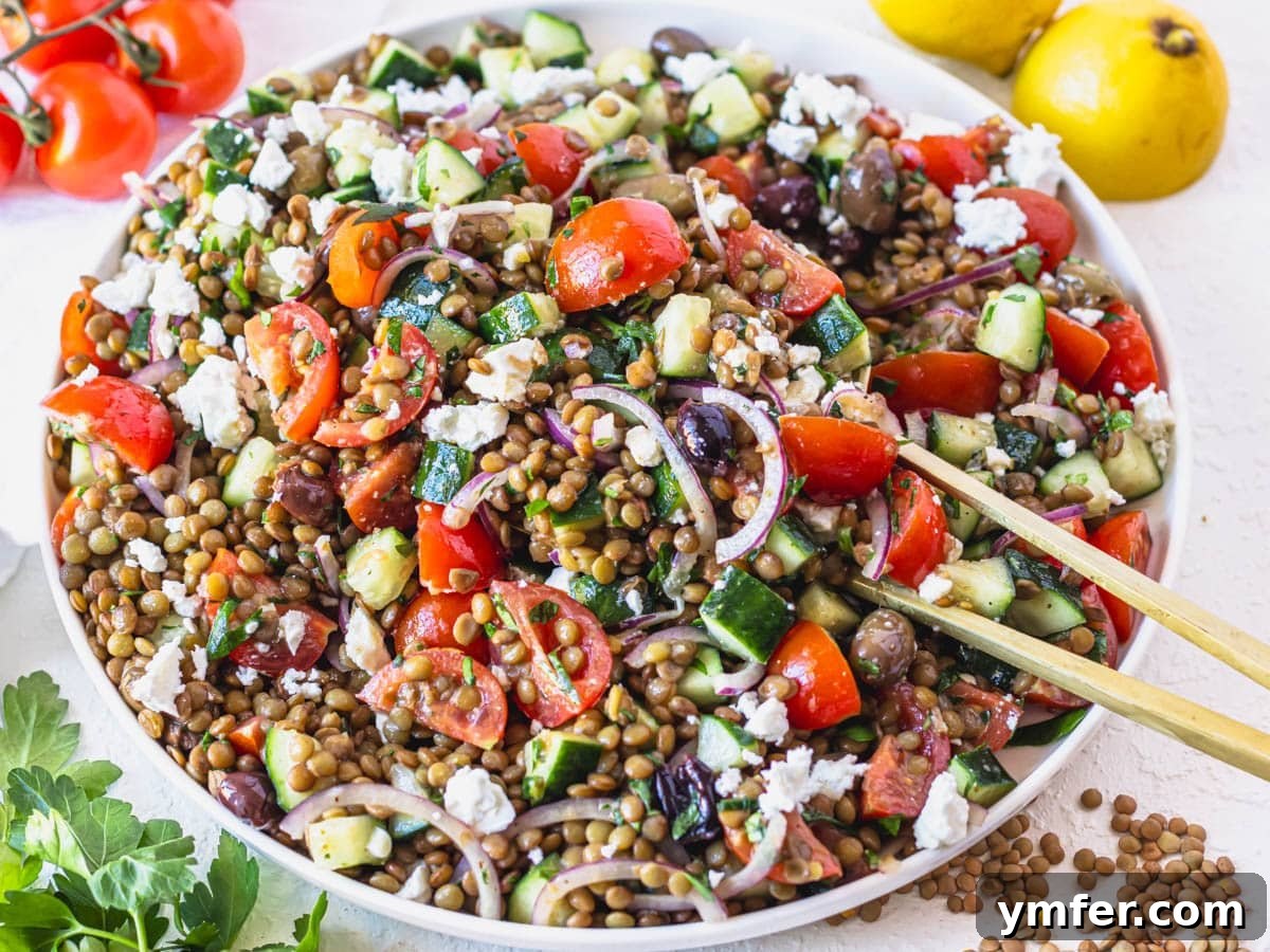 Feast on Plants: 35 Vibrant Recipes 10 Lentil salad garnished with feta cheese and lemon wedges on the side.