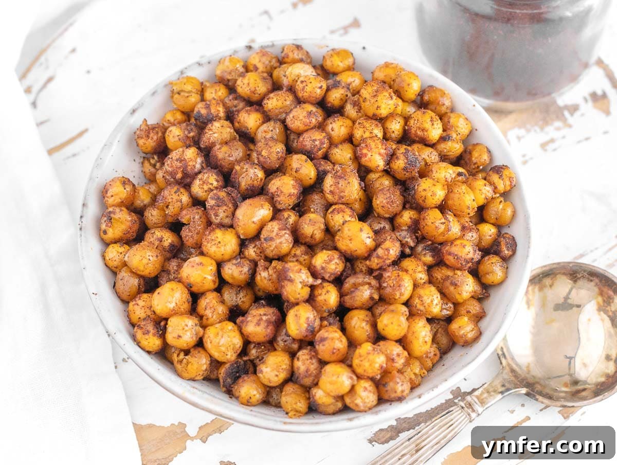 35 Plant-Powered Chickpea Creations 5 Oven-roasted chickpeas seasoned with chipotle powder, showing a perfectly crispy texture.