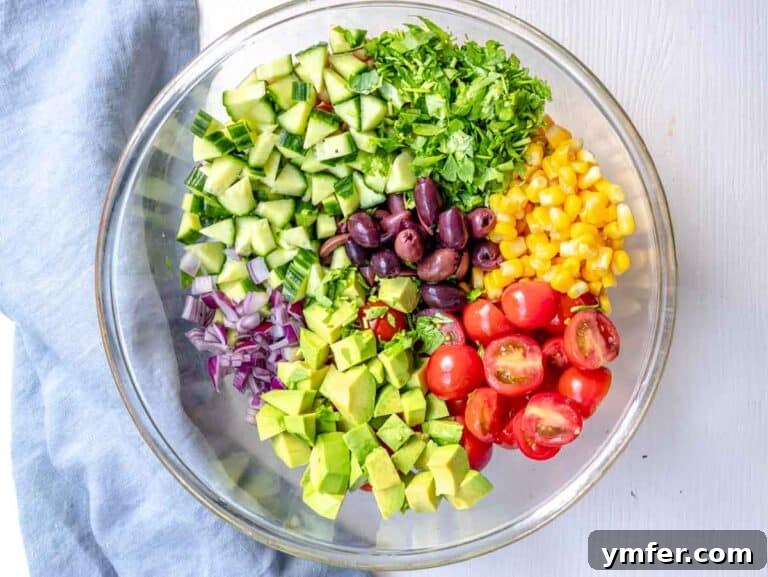 Zesty Quinoa Chickpea Power Salad 13 chopped vegetables in a glass bowl