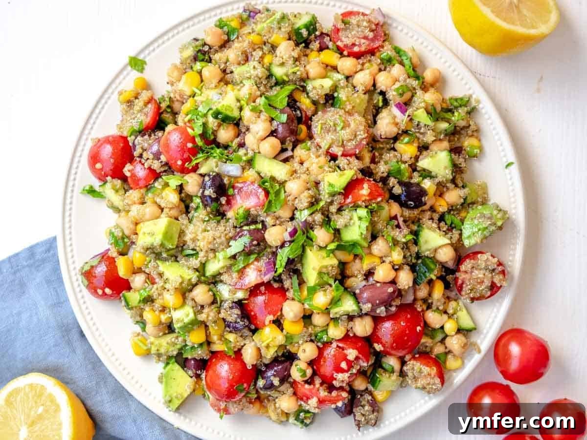 Zesty Quinoa Chickpea Power Salad 9 Chickpea quinoa salad served on a large white plate.