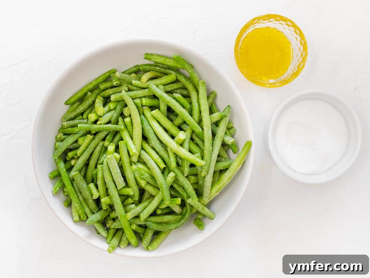 Crispy Air Fryer Green Beans 11 Frozen green beans being seasoned in a bowl
