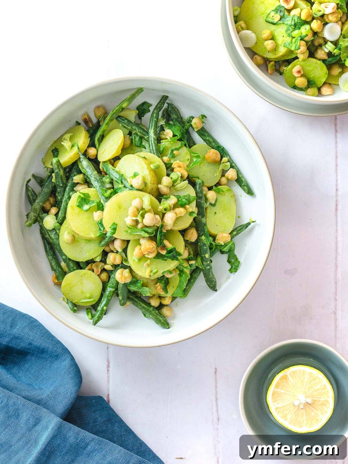 Crispy Air Fryer Green Beans 14 A vibrant potato salad with green beans and a generous dollop of pesto