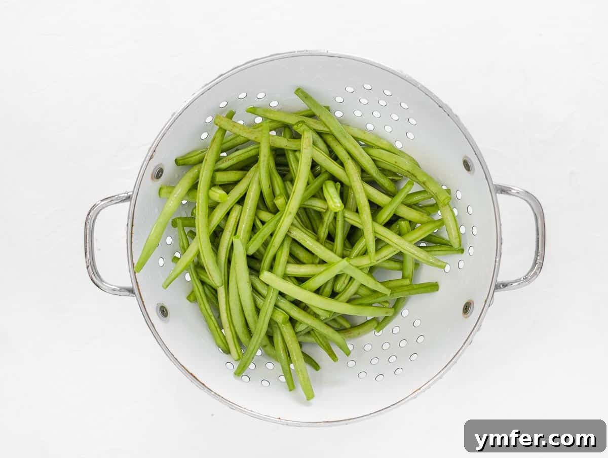 Crispy Air Fryer Green Beans 6 Cleaned green beans in a colander after rinsing