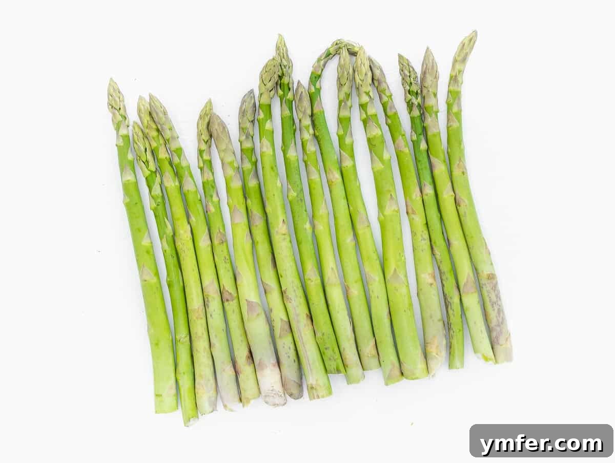 Crispy Air Fryer Asparagus 4 raw asparagus on the table