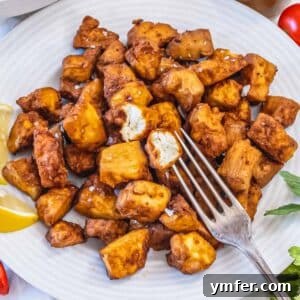 Air fryer tofu recipe, showcasing perfectly cooked pieces.